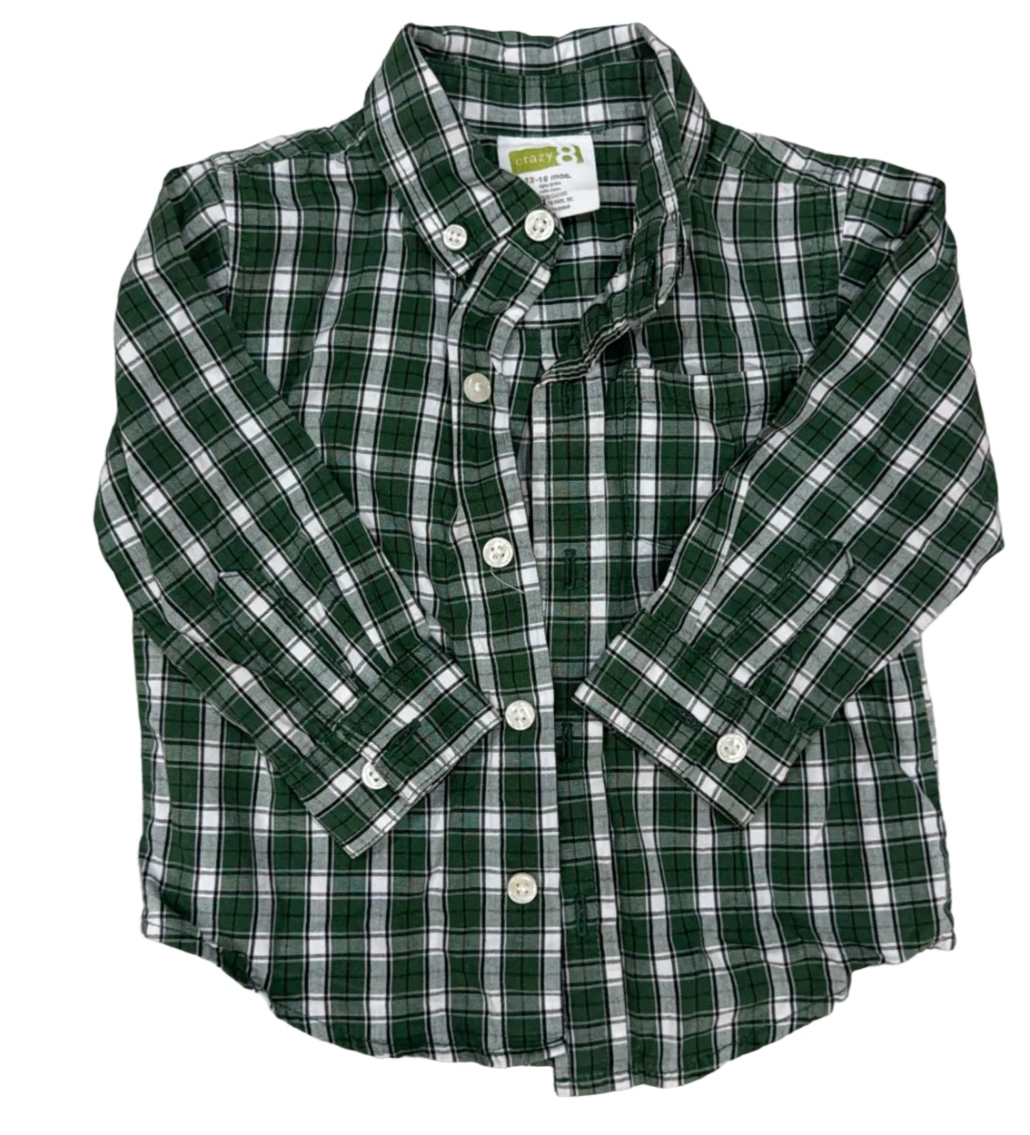A green and white plaid long-sleeve button-down shirt laid flat on a light wood floor.